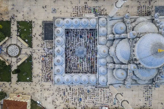 A drone photo shows an aerial view of the Fatih Mosque as Muslims gather to perform Eid al-Adha prayer obeying social distance rules amid COVID-19 pandemic precautions in Istanbul, Turkey on July 20, 2021. (Photo by Yunus Emre Gunaydin/Anadolu Agency via Getty Images)