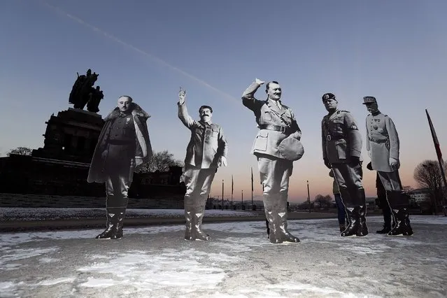 Members of the campaigning community Avaaz placed life-size cardboards, depicting Benito Mussolini, Adolf Hitler, Josef Stalin, Francisco Franko and Philippe Petain in front of the Kaiser Wilhelm monument at the Deutsches Eck (“German Corner”) to protest against a European far-right leaders meeting, in Koblenz, Germany, January 21, 2017. (Photo by Kai Pfaffenbach/Reuters)