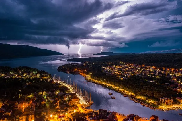 Wild Night in the Adriatic. Nature Commended. Stari Grad, on Hvar Island, with fork lightning and a waterspout on the open sea. (Photo by Miroslav Zadravec/Drone Photography Awards 2021)