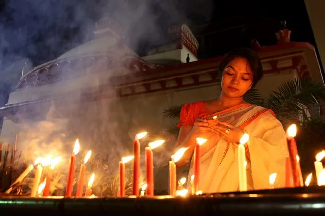 Hindu devotees celebrate Diwali with oil lamps, candles, Incense and flowers at Dhakeshwari Temple in Dhaka on November 12, 2023. (Photo by Syed Mahabubul Kader/ZUMA Press Wire/Rex Features/Shutterstock)