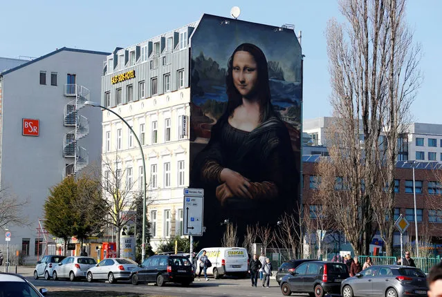 A mural by Berlin-based street art gang “Die Dixons” (The Dixons) which features a giant reproduction of Leonardo da Vinci's artwork Mona Lisa, is seen near East Side Gallery in Berlin, Germany, February 25, 2019. (Photo by Fabrizio Bensch/Reuters)