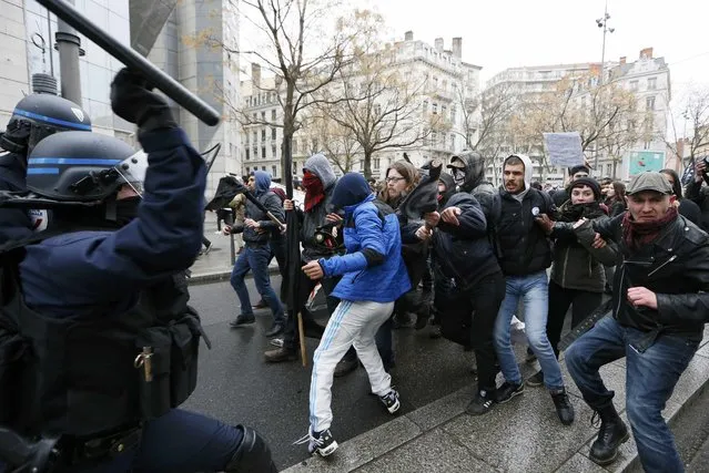 Students and workers face off with French police during a demonstration against the French labour law proposal in Lyon, France, as part of a nationwide labor reform protest, March 9, 2016. (Photo by Robert Pratta/Reuters)