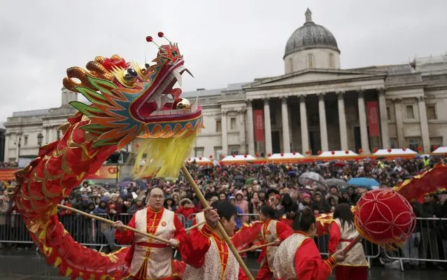 Participants carry a traditional dragon figure as they take part in an event to celebrate the Chinese Lunar New Year of the Rooster in London, Britain, January 29, 2017. (Photo by Neil Hall/Reuters)