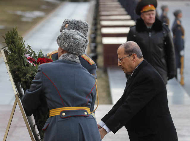 Lebanese President Michel Aoun attends a wreath laying ceremony at the Tomb of the Unknown Soldier by the Kremlin wall in Moscow, Russia, Tuesday, March 26, 2019. (Photo by Maxim Shemetov/Pool Photo via AP Photo)