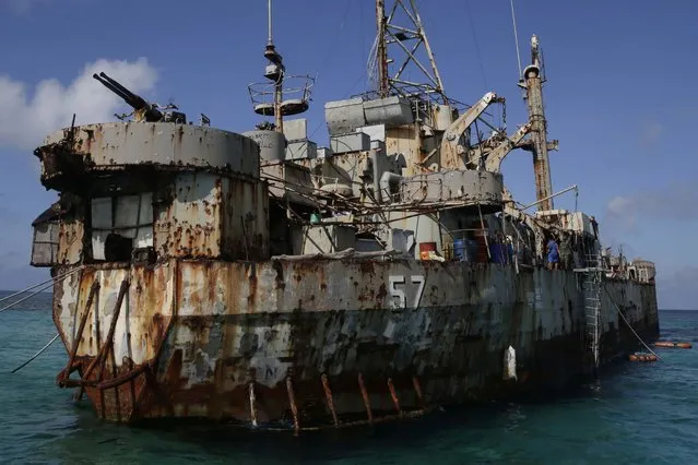A dilapidated Philippine Navy ship LT 57 (Sierra Madre) with Philippine troops deployed on board is anchored off Second Thomas Shoal, locally known as Ayungin Shoal, on March 30, 2014, in the South China Sea. Chinese coast guard ships blocked and used water cannons on two Philippine supply boats heading to a disputed shoal occupied by Filipino marines in the South China Sea, provoking an angry protest against China and a warning from the Philippine government that its vessels are covered under a mutual defense treaty with the U.S., Manila’s top diplomat said Thursday, Nov. 18, 2021. (Photo by Bullit Marquez/AP Photo/File)