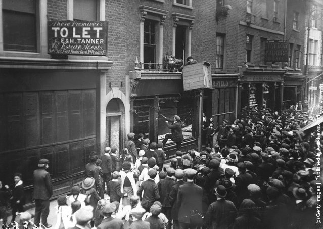 London crowds attack a German business premises in Poplar High Street in the East End of London, 1915