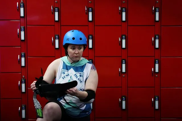 Karen “Biscuits & Crazy” Velkovska, a member of New York's Long Island Roller Rebels gets ready for practice at the United Skates of America Roller Skating facility in Massapequa, New York, U.S., on March 19, 2024. (Photo by Shannon Stapleton/Reuters)