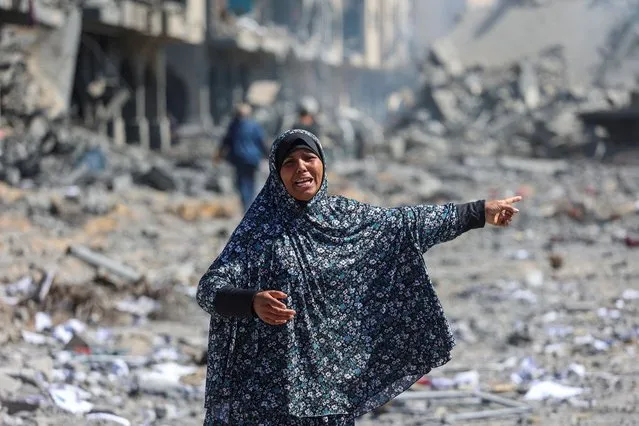 A Palestinian woman reacts after her apartment was destroyed in an Israeli raid, in Qatari-funded Hamad City, amid the ongoing conflict between Israel and Hamas, in Khan Younis in the southern Gaza Strip on March 13, 2024. (Photo by Ahmed Zakot/Reuters)