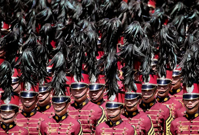 Filipino graduating police officers march during an event for the 2019 graduating class of the Philippine National Police Academy (PNPA) at Camp General Mariano Castaneda in Silang, Philippines, 22 March 2019. According to reports, Duterte on March 21, formally announced the end of government's peace negotiations with communist rebels. The president ordered a stop to peace talks with the communist rebels, due to continued attacks on government forces by the communist armed group “New People's Army”. (Photo by Francis R. Malasig/EPA/EFE)
