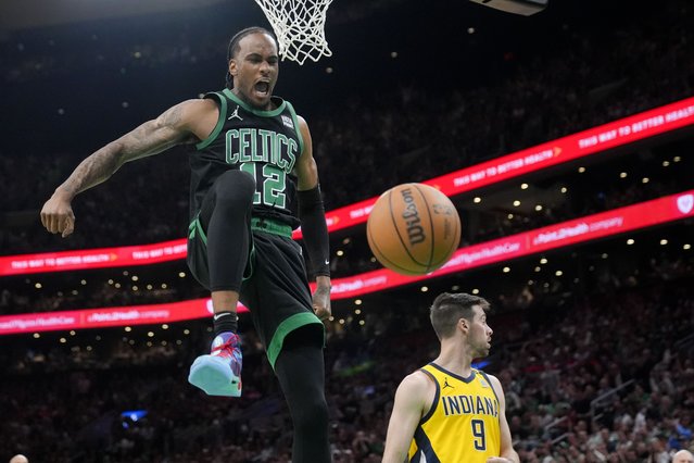 Boston Celtics forward Oshae Brissett (12) celebrates after dunking against the Indiana Pacers during the second half of Game 2 of the NBA Eastern Conference basketball finals Thursday, May 23, 2024, in Boston. (Photo by Steven Senne/AP Photo)