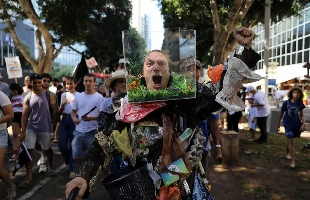 People take part in a protest against climate change during an event in Tel Aviv, Israel on September 27, 2019. (Photo by Ammar Awad/Reuters)