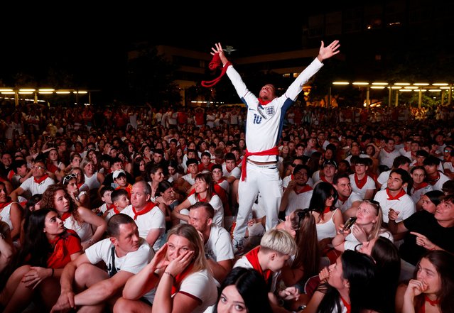 An England fan celebrates after England's Cole Palmer scores their first goal among Spain fans on July 14, 2024. (Photo by Vincent West/Reuters)