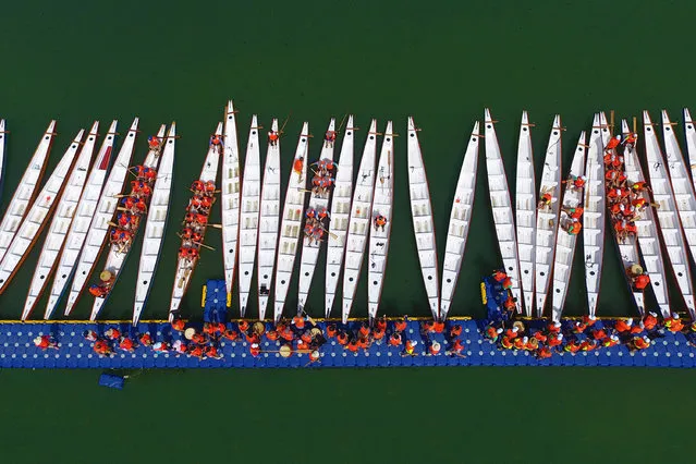 Aerial view of dragon boat teams preparing for the dragon boat race on the Fujiang River on May 4, 2017 in Suining, Sichuan Province of China. 34 dragon boat teams will participate in the upcoming dragon boat race held on May 30. The last dragon boat race held by Shehong County can be traced back to 1985. (Photo by VCG/VCG via Getty Images)