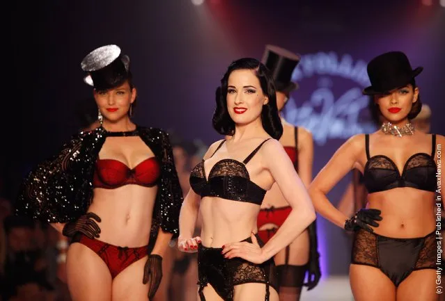 Dita Von Teese and models showcases designs by Von Folies by Dita Von Teese on the runway during L'Oreal Melbourne Fashion Festival