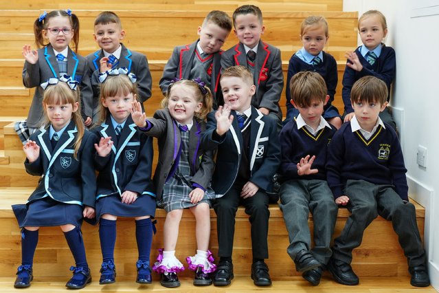 Six sets of twins (left to right, top) Eva-Grace and Greyson McNab, Carter and Greyson Cearns, Demi Rose and Nicole Anne Campbell-Black, (bottom) Ellie Joanne and Hannah Margaret Wilson, Evie and Lukas McGowan, Benjamin and Myles Jones, all due to start the new school term in the Inverclyde area pose for a photograph at St Patrick's Primary School in Greenock, Inverclyde, ahead of the first day at their respective schools on Tuesday, August 13, 2024. (Photo by Jane Barlow/PA Images via Getty Images)