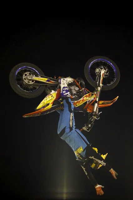 Spanish rider Pedro Moreno performs a jump during the Malaga Freestyle motocross show at the Malagueta bullring in Malaga, southern Spain, August 1, 2015. (Photo by Jon Nazca/Reuters)