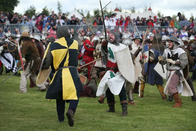 Crowds watch as the Battle of Bannockburn is re-enacted on June 28, 2014 in Stirling, Scotland. The 700th anniversary of the historic battle that saw the outnumbered Scots conquer the English led by Edward II in the First War of Scottish Independence. (Photo by Peter Macdiarmid/Getty Images)