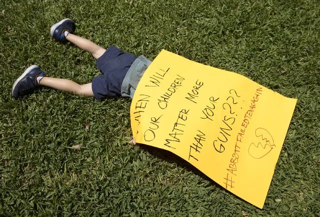 Remy Ragsdale, 3, attends a protest organized by Moms Demand Action on Wednesday May 25, 2022, at the Governor's Mansion in Austin, Texas, after a mass shooting at an elementary school in Uvalde. Photo by (Jay Janner/Austin American-Statesman via AP Photo)
