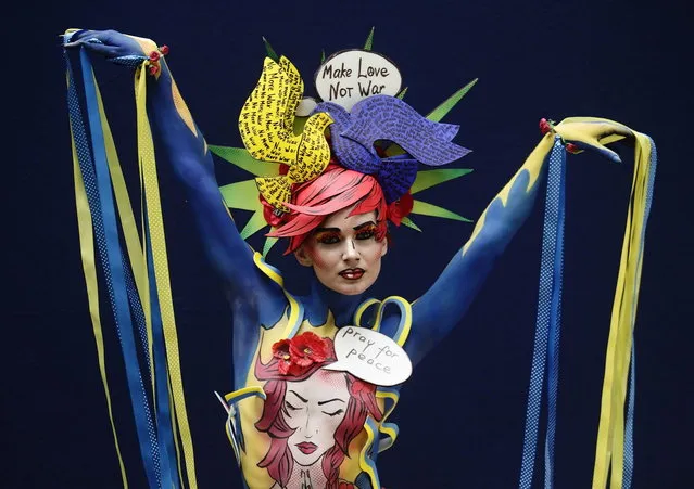 A model poses during the annual World Bodypainting Festival in Poertschach July 4, 2014. The event takes place from July 4 to 6 at lake Worthersee in Austria's southern Carinthia province. (Photo by Heinz-Peter Bader/Reuters)