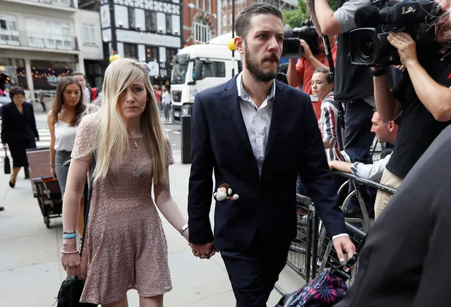 Connie Yates and Chris Gard, the parents of critically ill baby Charlie Gard, arrive at the high court for a fresh legal battle over their wish to take Charlie to the US for an experimental medical treatment in London, England on July 13, 2017. A U.S. doctor offering experimental treatment to a critically ill British baby could fly to London in the next few days in a bid to help persuade a judge not to allow a hospital to turn off his life support. The parents of 11-month-old Charlie Gard have been fighting a legal battle to send their son to the United States for the experimental therapy, but Britain's courts have refused permission on the grounds it would prolong his suffering without any realistic prospect of it helping. (Photo by Peter Nicholls/Reuters)