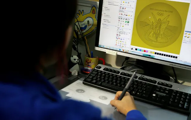 A sculptress from the Casa da Moeda do Brasil (Brazilian Mint) works on the Rio 2016 Olympic medal at her computer in Rio de Janeiro, Brazil, June 28, 2016. (Photo by Sergio Moraes/Reuters)