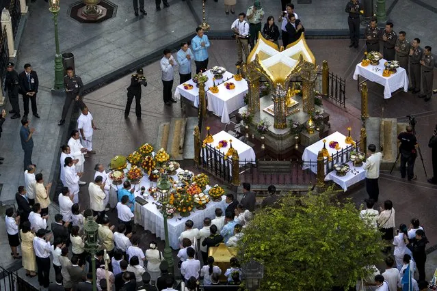 Thai government officials attend a religious ceremony at the Erawan shrine, the site of Monday's deadly blast, in central Bangkok, Thailand, August 21, 2015. (Photo by Athit Perawongmetha/Reuters)