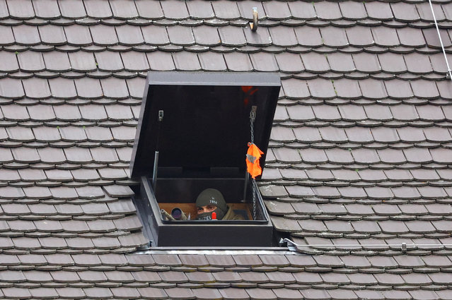 A German police sniper takes position before German President Frank-Walter Steinmeier meets with Turkey President Recep Tayyip Erdogan at Bellevue Castle in Berlin, Germany on November 17, 2023. (Photo by Fabrizio Bensch/Reuters)