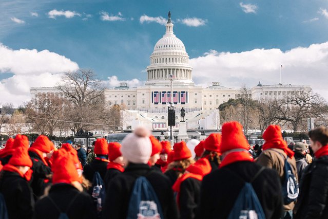 Pro-Trump supporters gather at the National Mall before the inauguration of the 47th President of the United States of America, Donald J. Trump on January 20, 2025 in Washington, DC. Cold temperatures have forced the ceremony inside, but spectators still gather outside and around the city to celebrate. (Photo by Jim Vondruska/Getty Images/AFP Photo)