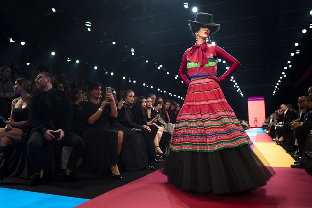A model presents a creation from Lithuanian designer Juozas Statkevicius' Haute Couture Spring-Summer 2024 fashion collection in Vilnius, Lithuania, Friday, December 8, 2023. (Photo by Mindaugas Kulbis/AP Photo)