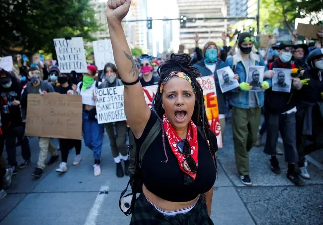 Rashyla Levitt helps lead a peaceful protest of over a thousand against the death in Minneapolis police custody of George Floyd, in Seattle, Washington, U.S. June 1, 2020. (Photo by Lindsey Wasson/Reuters)