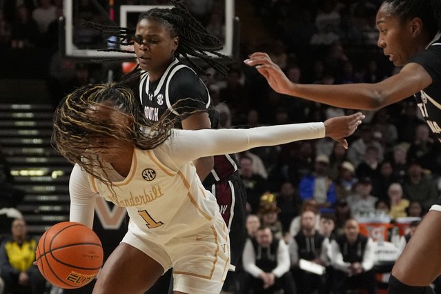 Vanderbilt guard Mikayla Blakes (1) dribbles the ball past South Carolina defenders during the first half of an NCAA college basketball game Sunday, February 23, 2025, in Nashville, Tenn. (Photo by George Walker IV/AP Photo)