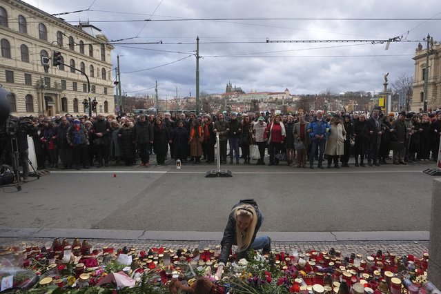 People stand as a human chain to honor victims of mass shooting in front of the building of Philosophical Faculty of Charles University in Prague, Czech Republic, Thursday, January 4, 2024. Thousands of students and other Czechs marched in silence in the Czech capital on Thursday to honor the victims of the country's worst mass killing that left 14 dead on Dec. 21, 2023. (Photo by Petr David Josek/AP Photo)