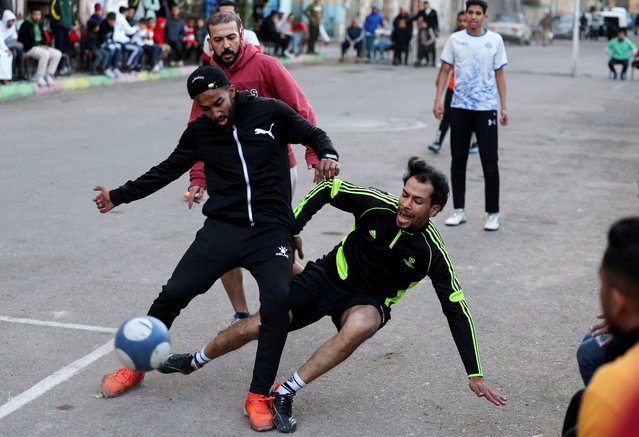 Players take part in a “Sock Ball” match during a Ramadan soccer tournament held on a street in Alexandria, Egypt on March 23, 2025. (Photo by Mohamed Abd El Ghany/Reuters)