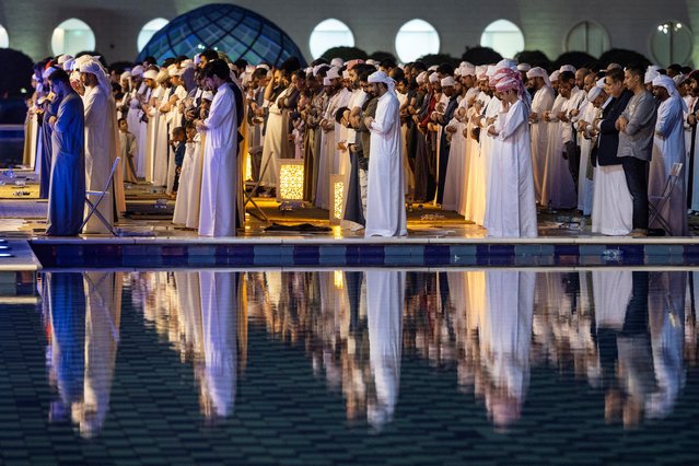 Muslims pray on Laylat al-Qadr, the Night of Destiny, believed to be when the Koran was first revealed to the Prophet Muhammad during the holy fasting month of Ramadan, at Sheikh Zayed Grand Mosque in Abu Dhabi on March 26, 2025. (Photo by Fadel Senna/AFP Photo)