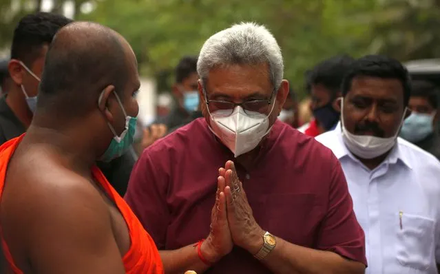 Sri Lankan President Gotabaya Rajapaksa wearing a face mask greets a Buddhist monk at the inauguration of Sri Lanka Podujana Peramuna (SLPP)'s election campaign leading up to the parliamentary elections at Anuradhapura (200km from capital Colombo), Sri Lanka on July 3, 2020. Accordingly, President Rajapaksa attended several public gatherings held in the Anuradhapura district to ensure the victory of the SLPP candidates contesting the upcoming general election. SLPP, Sri Lanka Podujana Peramuna is headed by President Gotabaya Rajapaksa's brother, prime minister Mahinda Rajapaksa. Sri Lanka will hold the Parliamentary Election on August 05 2020. (Photo by Tharaka Basnayaka/NurPhoto via Getty Images)