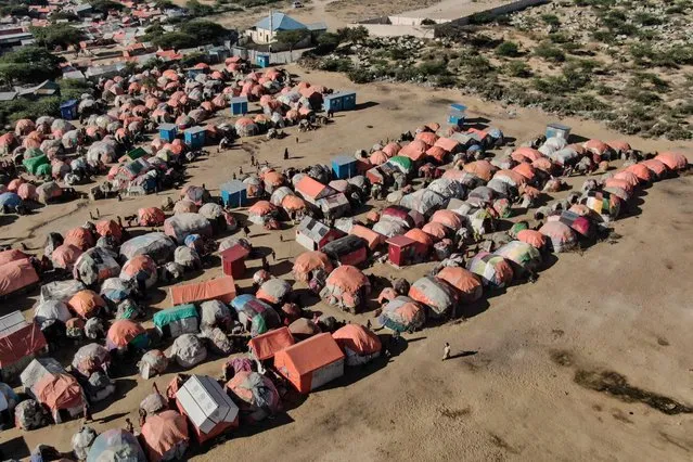 This aerial photograph shows makeshift tents at Limaan camp in Mogadishu on Wednesday, December 7, 2022 where internally displaced Somalis who fled from their settlement due to the severe drought conditions live. (Photo by Hassan Ali Elmi/AFP Photo)