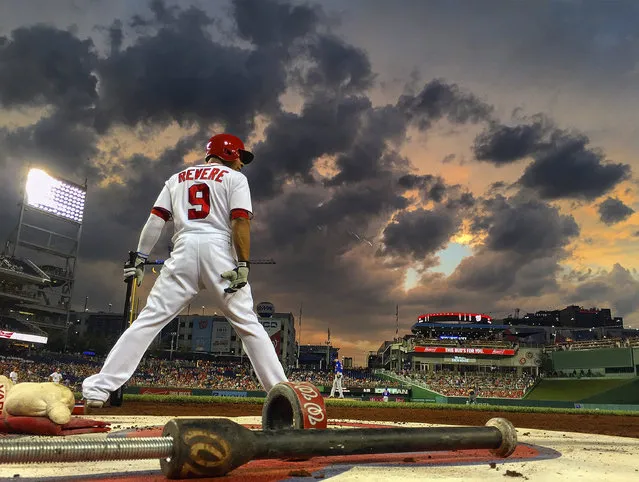 Washington's Ben Revere (9) stands on deck as storm clouds gather that lead to a mid game rain delay  as the Washington Nationals play the New York Mets at Nationals Park in Washington DC, June 28, 2016. (Photo by John McDonnell/The Washington Post)
