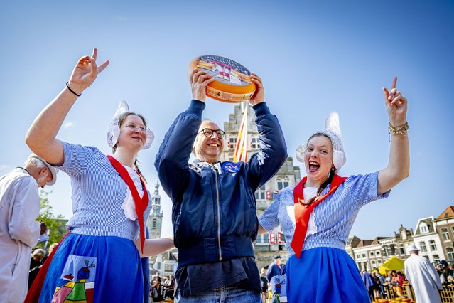 Tourists flocked to the historic Gouda Cheese Market on May 8, 2025, where the famous cheese has been traded for centuries. At the Waag in Gouda, farmers brought their cheeses by horse-drawn carts, where they were weighed, inspected, and sold in a vibrant tradition. (Photo by Splash News and Pictures)