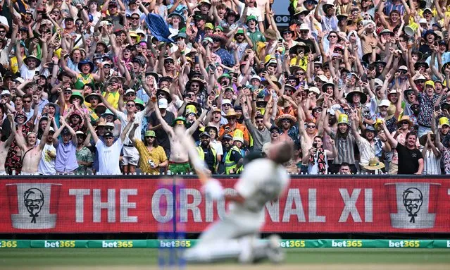 Spectators show support after David Warner of Australia reacts after made a double century during Day 2 of the Second Test match between Australia and South Africa at the Melbourne Cricket Ground (MCG) in Melbourne, Victoria, Australia, 27 December 2022. (Photo by James Ross/EPA/EFE/Rex Features/Shutterstock)