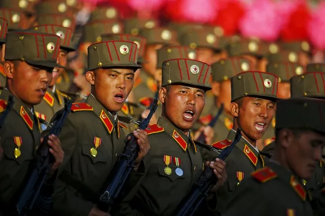 Soldiers shout as they march past a stand with North Korean leader Kim Jong Un during the parade celebrating the 70th anniversary of the founding of the ruling Workers' Party of Korea, in Pyongyang October 10, 2015. (Photo by Damir Sagolj/Reuters)