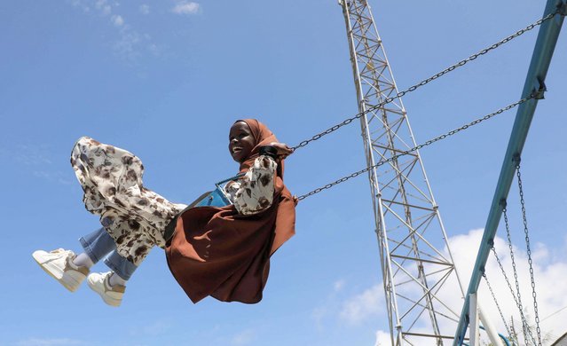 A Muslim girl plays at a funfair during prayers marking the Eid al-Adha holiday, following the celebrations in Mogadishu, Somalia, on June 6, 2025. (Photo by Feisal Omar/Reuters)