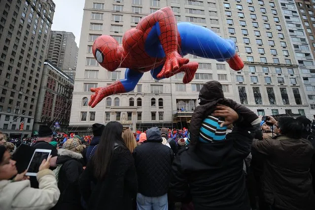 A Spiderman balloon floats at the  88th Annual Macy's Thanksgiving Day on November 27, 2014 in New York City. (Photo by Brad Barket/Getty Images)