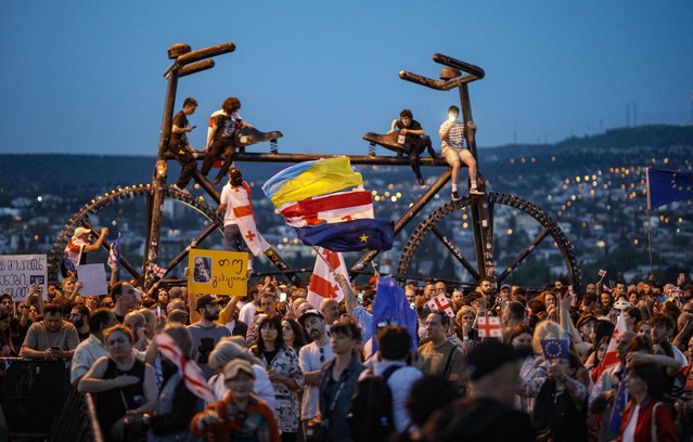 Georgian opposition party supporters attend a protest against a draft bill on “foreign agents” near the Georgia Parliament in Tbilisi, Georgia, 28 April 2024. The Georgian Parliament adopted the bill on foreign agents in the first reading amidst mass protests in Tbilisi. The second reading is scheduled for 30 April 2024. (Photo by David Mdzinarishvili/EPA/EFE)