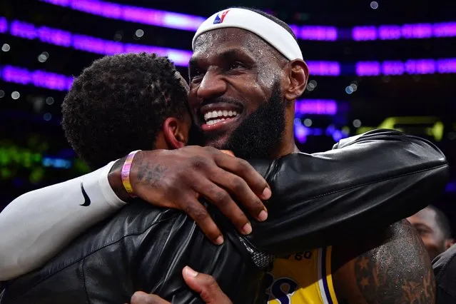 Los Angeles Lakers forward LeBron James hugs agent Rich Paul after breaking the all-time scoring record in the third quarter against the Oklahoma City Thunder at Crypto.com Arena in Los Angeles on February 7, 2023. (Photo by Gary A. Vasquez/USA TODAY Sports)