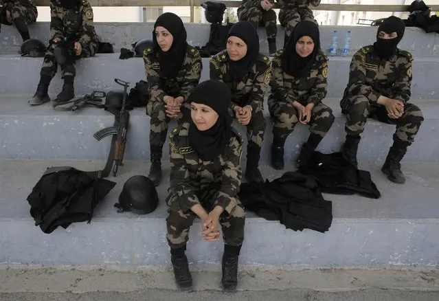 Female members of the Palestinian presidential guard watch a training session in the West Bank city of Jericho, in this April 6, 2014 file photo. (Photo by Ammar Awad/Reuters)