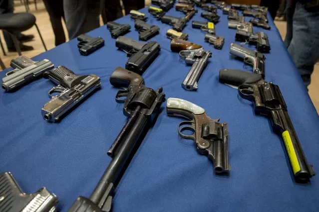 Confiscated illegal guns are displayed during a news conference at New York City Police (NYPD) Headquarters in New York, October 27, 2015. (Photo by Brendan McDermid/Reuters)