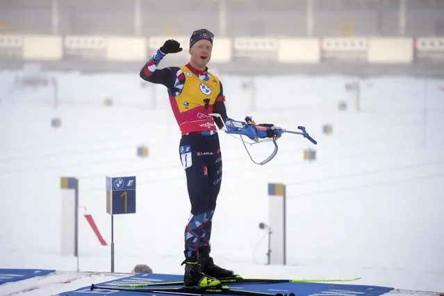 Johannes Thingnesnor Boe, of Norway, celebrates after his last shot, having hit all 20 targets, and on his way to take the gold medal in the Men 12.5 km Pursuit event at the Biathlon World Championships in Oberhof, Germany, Sunday, February 12, 2023. (Photo by Matthias Schrader/AP Photo)