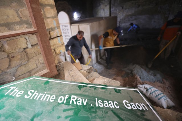 Iraqi workers restore the centuries-old shrine of Jewish Rabbi Isaac Gaon in central Baghdad's al-Kifah neighborhood on April 21, 2025. In a vibrant Baghdad district, labourers are working tirelessly to repair the shrine of the revered rabbi in an effort to revive the long-faded heritage of Iraq's Jewish community. (Photo by Ahmad Al-Rubaye/AFP Photo)