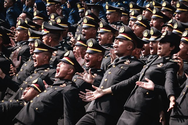 New Indonesian police officers perform during a commissioning ceremony for around 2,000 graduates from military and police academies at the Presidential Palace in Jakarta on July 23, 2025. (Photo by Yasuyoshi Chiba/AFP Photo)