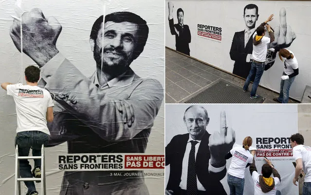 Reporters Without Borders exposes montages of world leaders, including Mahmoud Ahmadinejad (Iran), Xi Jinping (China) and Bashar al-Assad (Syria) and Vladimir Putin (Russia) in Paris, marking the 20th World Day of Freedom Media. (Photo by Benoit Tessier/Reuters)